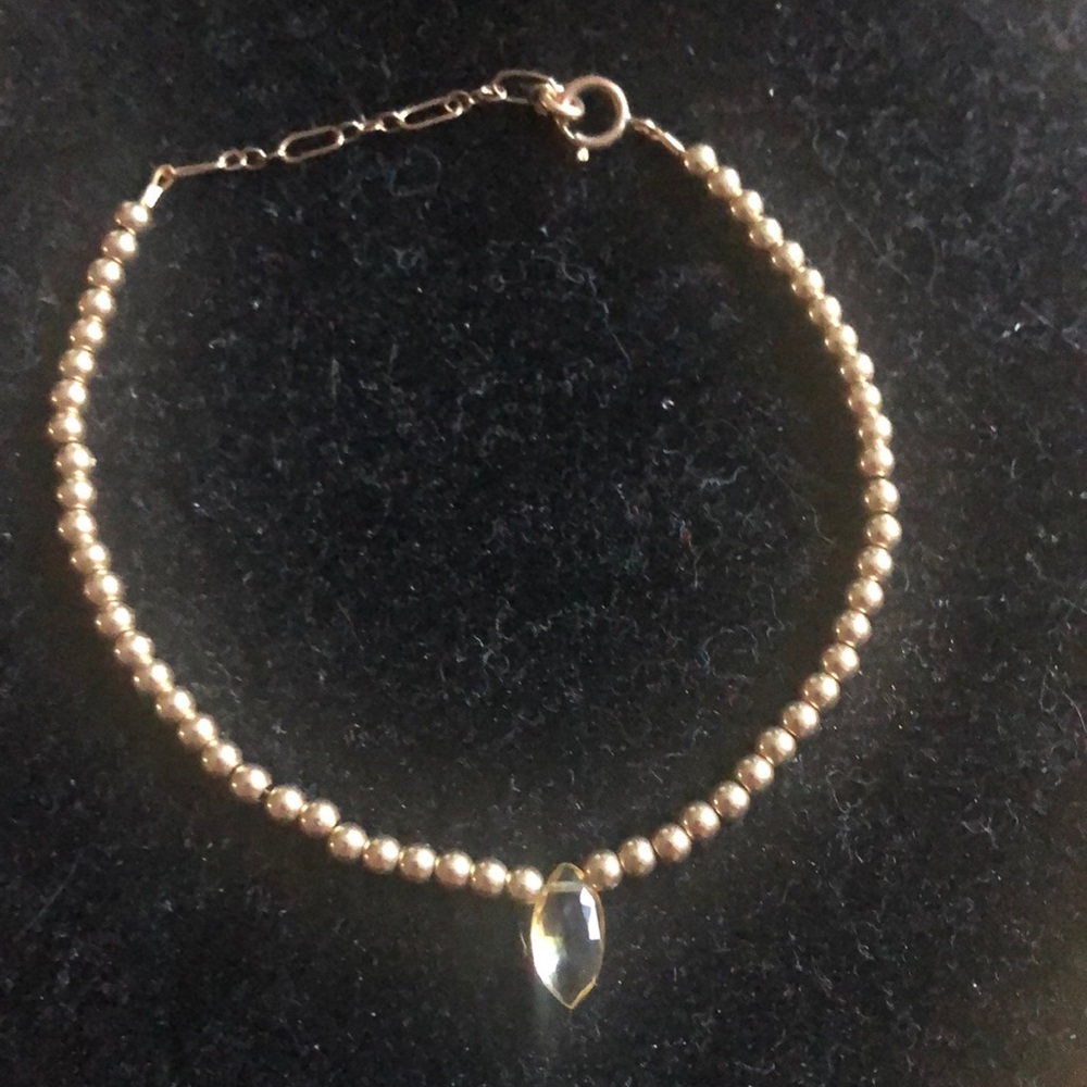 Gold tone gold filled beaded bracelet with marquise light yellow stone